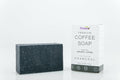 Premium coffee soap bar with activated charcoal from ShopOn9india, featuring a dark, textured soap with a rich coffee scent.